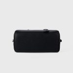A black pebbled vegan leather Boston bag with long shoulder straps, a top zipper, and a matching leather clochette. Additional product view 6.