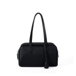 A black pebbled vegan leather Boston bag with long shoulder straps, a top zipper, and a matching leather clochette.