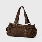 A gray and black leopard-print nylon shoulder bag with silver studs, dual straps, and utility side pockets. Additional product view 4.