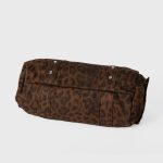A gray and black leopard-print nylon shoulder bag with silver studs, dual straps, and utility side pockets. Additional product view 6.