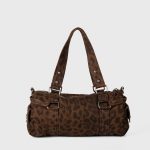 A gray and black leopard-print nylon shoulder bag with silver studs, dual straps, and utility side pockets. Additional product view 8.