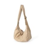A blush pink padded polyester crescent shoulder bag with a wide adjustable strap and silver zipper, isolated on white. Additional product view 3.
