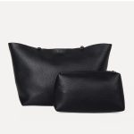 A slouchy black pebbled vegan leather tote with long thin shoulder straps and an open trapezoid silhouette. Additional product view 6.