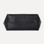 A slouchy black pebbled vegan leather tote with long thin shoulder straps and an open trapezoid silhouette. Additional product view 8.