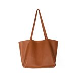 A slouchy black pebbled vegan leather tote with long thin shoulder straps and an open trapezoid silhouette. Additional product view 5.