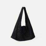 A matte black faux suede hobo bag with a slouchy triangular silhouette and a wide integrated shoulder strap. Additional product view 5.