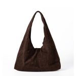 A matte black faux suede hobo bag with a slouchy triangular silhouette and a wide integrated shoulder strap. Additional product view 2.