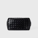 A black woven vegan leather bucket shoulder bag with matching tubular straps and a tight diagonal intrecciato weave. Additional product view 7.