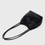 A black woven vegan leather bucket shoulder bag with matching tubular straps and a tight diagonal intrecciato weave. Additional product view 8.