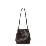 A black woven vegan leather bucket shoulder bag with matching tubular straps and a tight diagonal intrecciato weave. Additional product view 2.