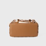 A black laser-cut vegan leather cage tote with a cream drawstring inner pouch and two matching top handles. Additional product view 7.