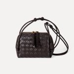 A dark espresso brown woven vegan leather mini dome crossbody with thin knotted cord straps and a gold-tone zipper. Additional product view 7.