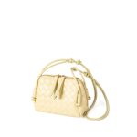 A dark espresso brown woven vegan leather mini dome crossbody with thin knotted cord straps and a gold-tone zipper. Additional product view 6.