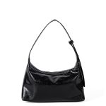 A glossy black crinkled vegan leather crescent underarm bag with a knotted side strap and a silver zipper pull.
