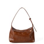 A glossy black crinkled vegan leather crescent underarm bag with a knotted side strap and a silver zipper pull. Additional product view 2.