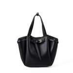 A small black vegan leather bucket bag with dual top handles and a gold-tone buckle strap wrapped around the body.