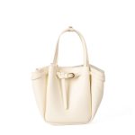 A small black vegan leather bucket bag with dual top handles and a gold-tone buckle strap wrapped around the body. Additional product view 2.