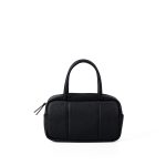 A boxy black pebbled vegan leather mini Boston bag with rolled top handles and long zipper pulls.