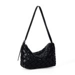 A black basketweave vegan leather crescent underarm bag with a slim adjustable strap and a silver top zipper. Additional product view 2.