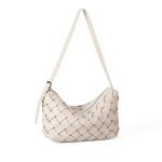 A black basketweave vegan leather crescent underarm bag with a slim adjustable strap and a silver top zipper. Additional product view 3.