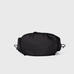 A black nylon drawstring backpack with ruffled cinch opening, side pockets, webbing straps, and a small top handle. Additional product view 7.