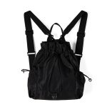 A black nylon drawstring backpack with ruffled cinch opening, side pockets, webbing straps, and a small top handle.