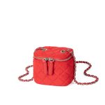 A small black quilted faux suede vanity box bag with dual silver zippers and a chain strap interwoven with black cord. Additional product view 5.