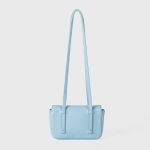 A dusty pink pebbled vegan leather baguette with a silver turn-lock flap and two long thin shoulder straps. Additional product view 7.