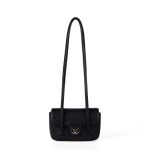 A dusty pink pebbled vegan leather baguette with a silver turn-lock flap and two long thin shoulder straps.