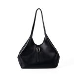 A slouchy black vegan leather tote with integrated shoulder straps and a thin vertical strap finished with a silver buckle. Additional product view 2.