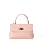 A dark brown glossy vegan leather top-handle flap bag with a gold-tone oval twist-lock centered on the front. Additional product view 3.