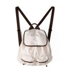 A black nylon backpack with cognac brown vegan leather piping, a top flap over a drawstring, and two lower front pockets. Additional product view 2.