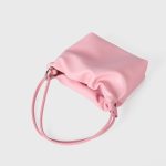 A tiny black vegan leather dumpling bag with a ruffled gathered opening and a thin tubular shoulder strap. Additional product view 9.