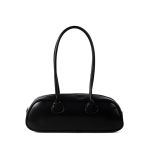 A long black vegan leather east-west baguette with two thin tubular straps and a silver zipper along the top.