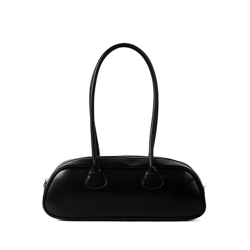 A long black vegan leather east-west baguette with two thin tubular straps and a silver zipper along the top.