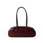 A long black vegan leather east-west baguette with two thin tubular straps and a silver zipper along the top. Additional product view 2.