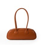 A long black vegan leather east-west baguette with two thin tubular straps and a silver zipper along the top. Additional product view 3.