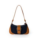 A beige woven canvas baguette with dark brown vegan leather corner patches, a center buckle strap, and a slim shoulder strap. Additional product view 5.