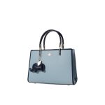 A structured sky blue satchel with navy trim, gold-tone hardware, a single top handle, and a navy elephant charm. Additional product view 3.