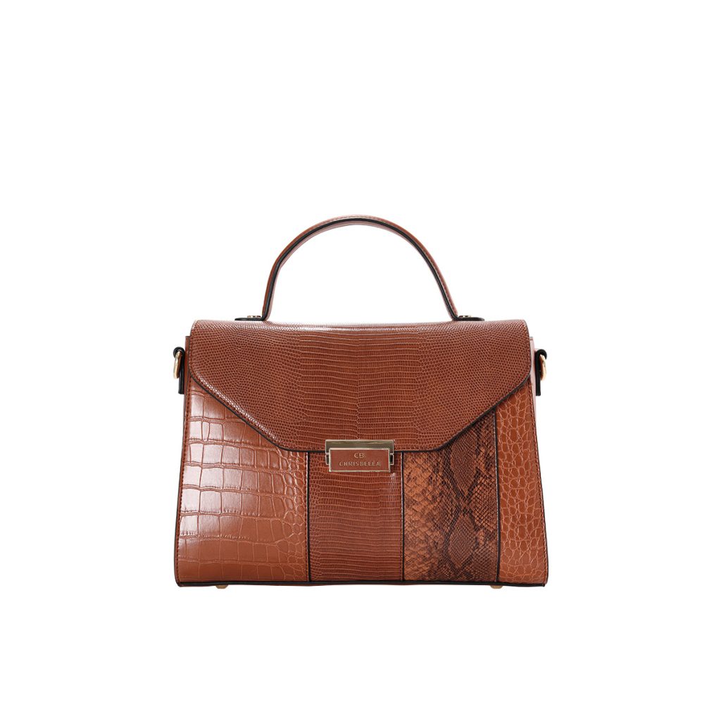 A cognac brown vegan leather satchel mixing crocodile, lizard, and snakeskin textures with a gold-tone front clasp.