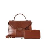 A cognac brown vegan leather satchel mixing crocodile, lizard, and snakeskin textures with a gold-tone front clasp. Additional product view 2.
