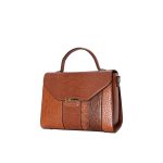 A cognac brown vegan leather satchel mixing crocodile, lizard, and snakeskin textures with a gold-tone front clasp. Additional product view 3.