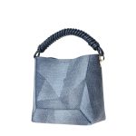A blue geometric-patterned bucket bag with a twisted navy top handle, matching inner pouch, and detachable crossbody strap. Additional product view 3.
