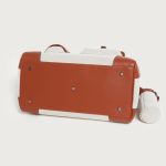 A large black utility tote with mixed canvas and vegan leather panels, multiple cargo pockets, and a silver turn-lock. Additional product view 8.