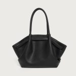 A large off-white pebbled vegan leather tote with folded winged sides, slim shoulder straps, and a gold center clasp. Additional product view 4.