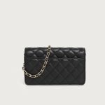 A small black diamond-quilted vegan leather flap bag with a gold flower emblem and a leather-woven gold chain strap. Additional product view 8.