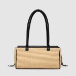 A rectangular straw raffia baguette with a black vegan leather flap, gold turn-lock, dual straps, and side leather tassels. Additional product view 4.