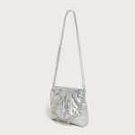 A pastel pink quilted vegan leather pouch with a gathered top, gold chain strap, and a detachable flat crossbody strap. Additional product view 6.