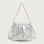 A pastel pink quilted vegan leather pouch with a gathered top, gold chain strap, and a detachable flat crossbody strap. Additional product view 4.