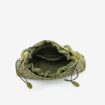 A dark brown woven vegan leather underarm bag with a thin braided strap and decorative side ties ending in leather tabs. Additional product view 6.